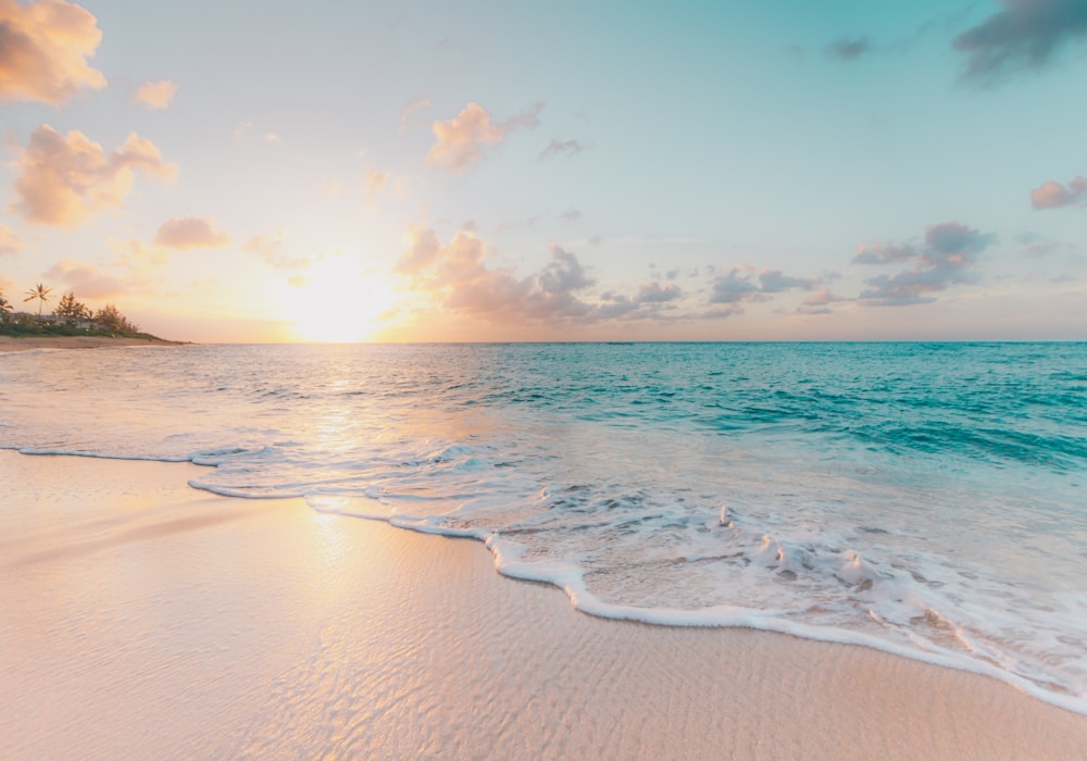 Quiet tropical beach at sunrise during shoulder season